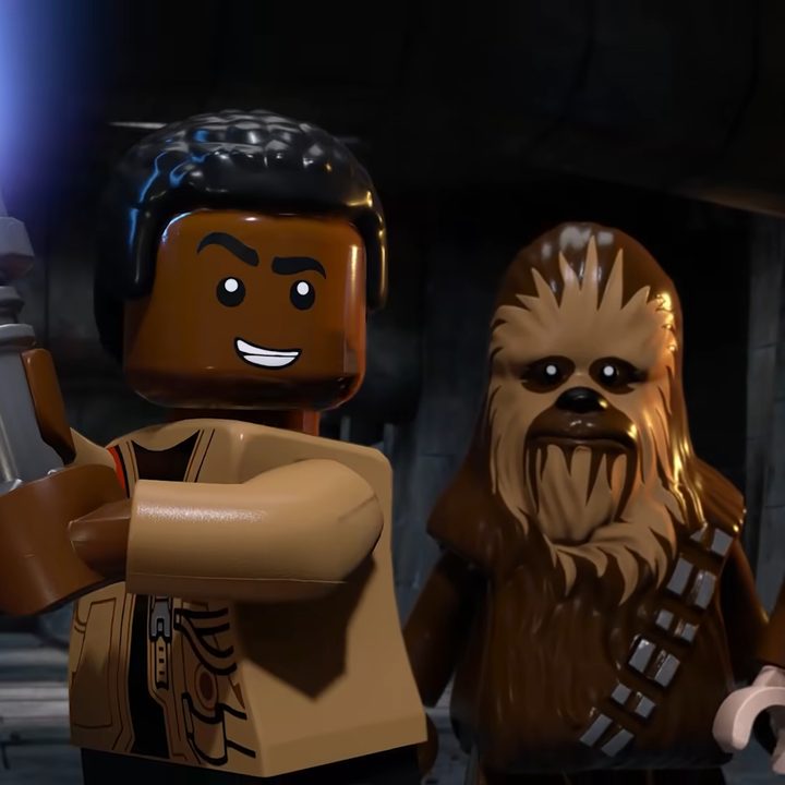 Lego Finn holding a lightsaber.