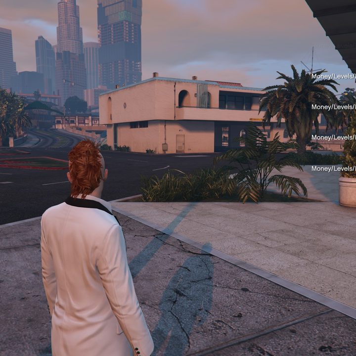A text chat with advertisements for cheats in GTA Online.
