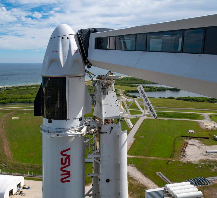 A close-up view of the SpaceX Falcon 9 rocket vertical with the Crew Dragon for the Crew-3 mission at Launch Pad 39A.