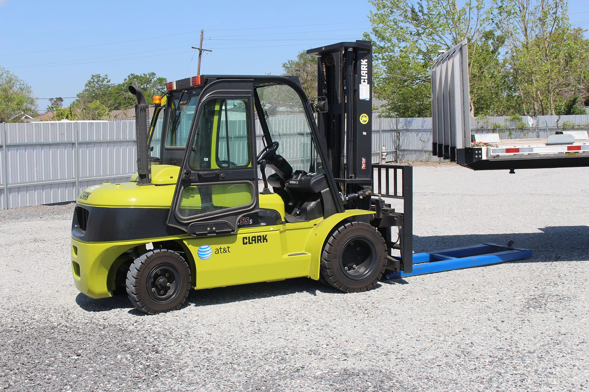 Forklift in a parking lot.