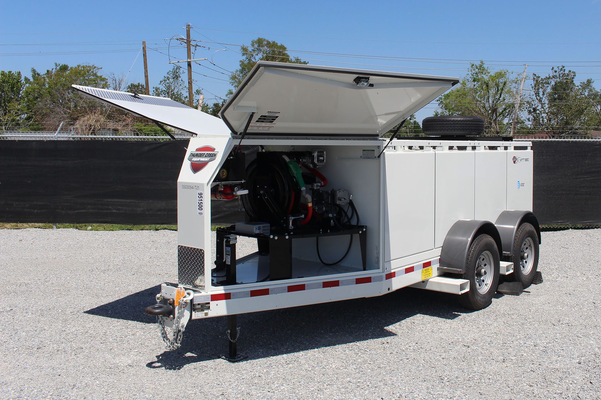 Fuel pump trailer in a parking lot.