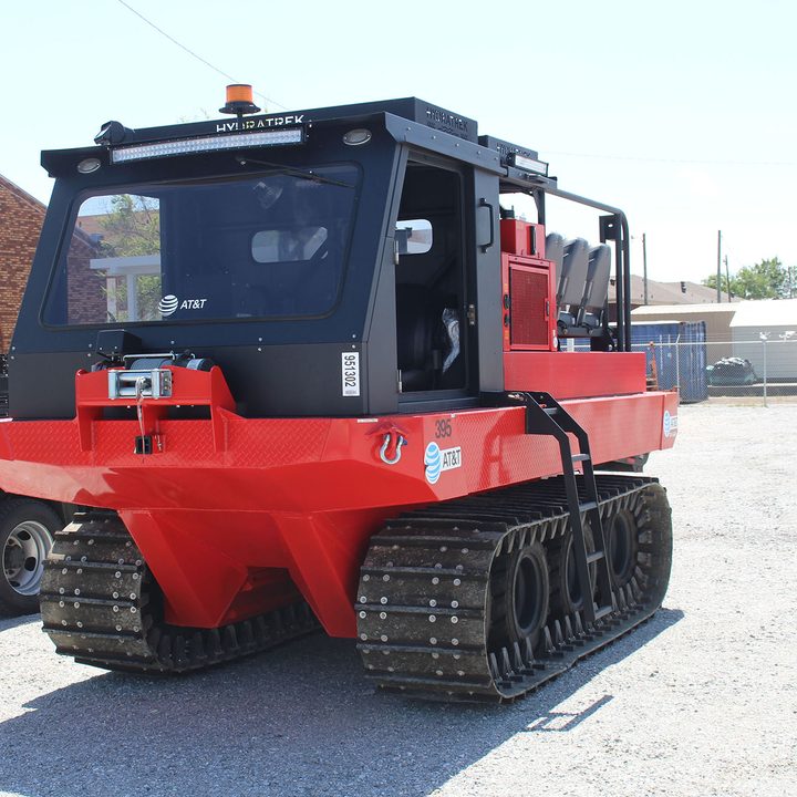 Hydratrek amphibious vehicle in a parking lot.
