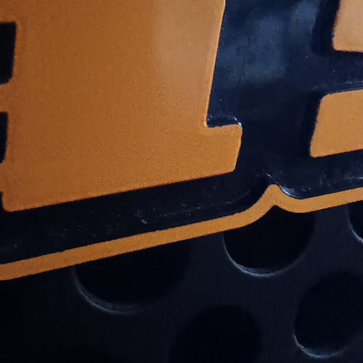 Closeup macro shot of a bass amp's brand name badge