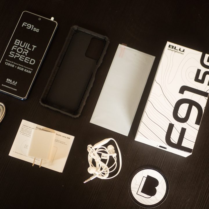 Blu F91 and accessories arranged on a table.