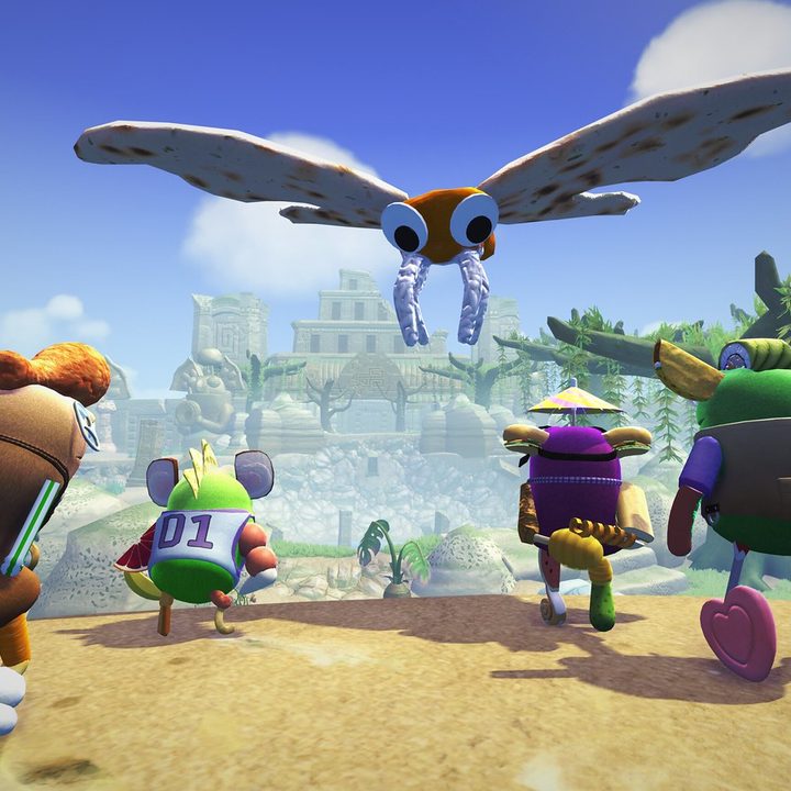 Bugsnax characters look up at a giant moth in the Isle of BIGsnax DLC.