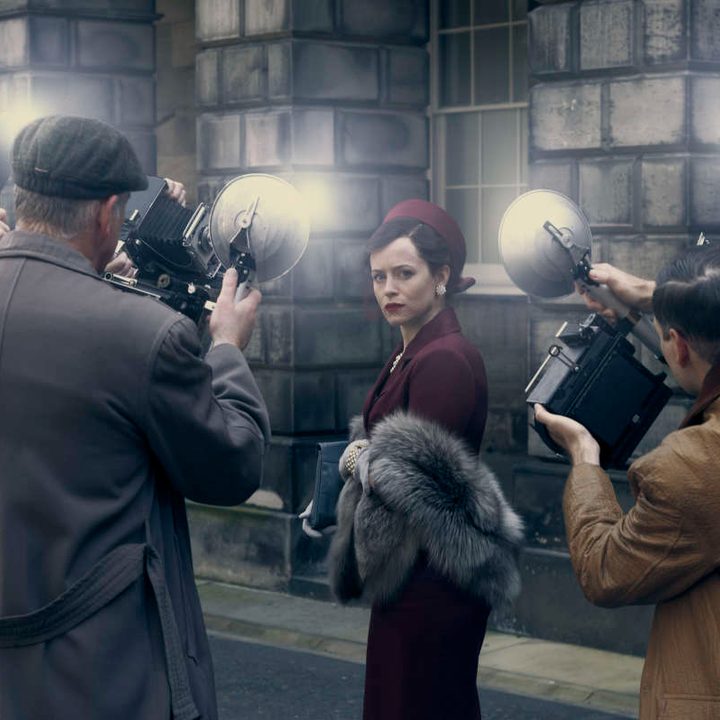 Photographers take pictures of Claire Foy in A Very British Scandal.