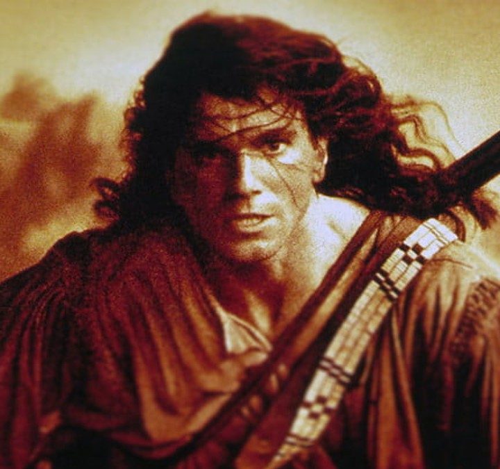 Daniel Day-Lewis charges forward on the poster for Michael Mann's The Last of the Mohicans.