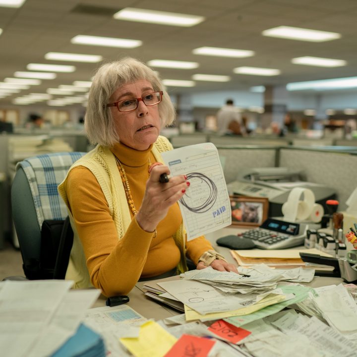 Deirdre holds up a receipt in Everything Everywhere All At Once.