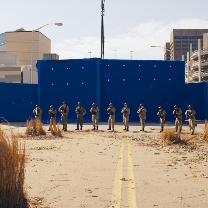 An image from the DMZ series featuring actors in front of a blue screen.