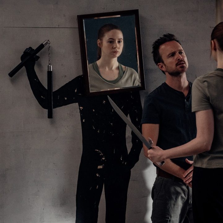 Aaron Paul and Karen Gillan discuss combat techniques in a scene from Dual.