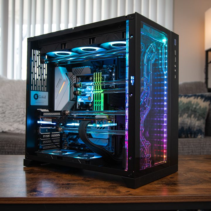 Thw EK Fluid Conquest PC sitting on a coffee table in front of a window.