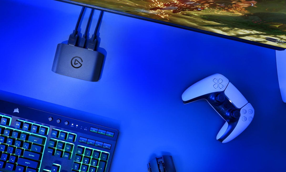 An Elgato HD60 X next to a keyboard and PS5 controller.
