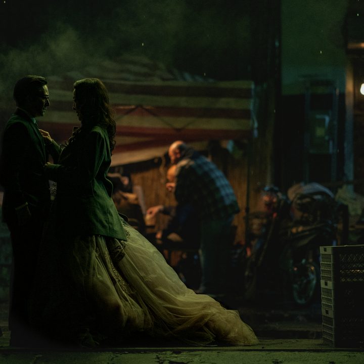 Evelyn and Waymond stand together in an alleyway in Everything Everywhere All At Once.