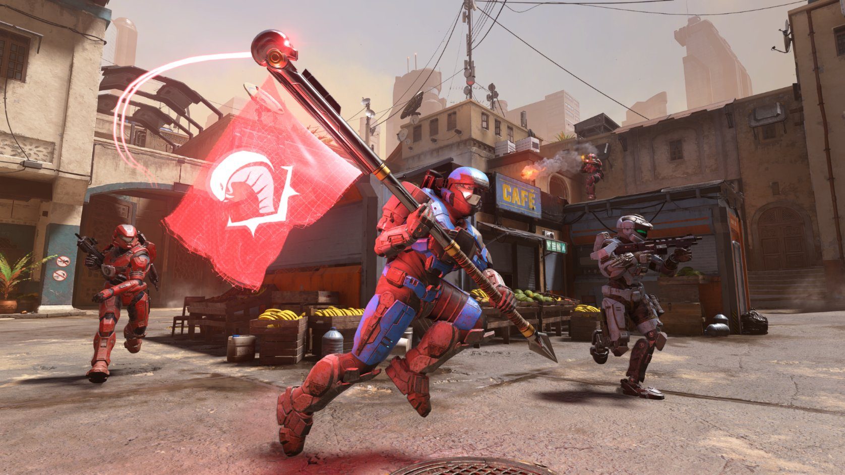 A team of Spartans transports the enemy flag in Halo Infinite.