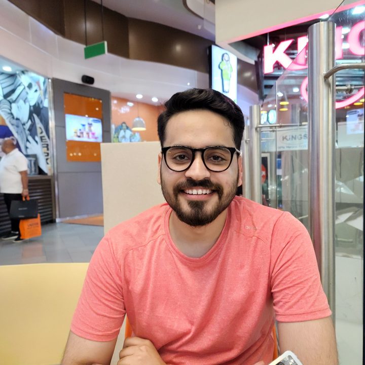 Prakhar Khanna sitting with arms crossed.