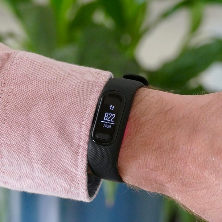 Garmin Vivosmart 5 worn on a man's wrist, showing the step count.