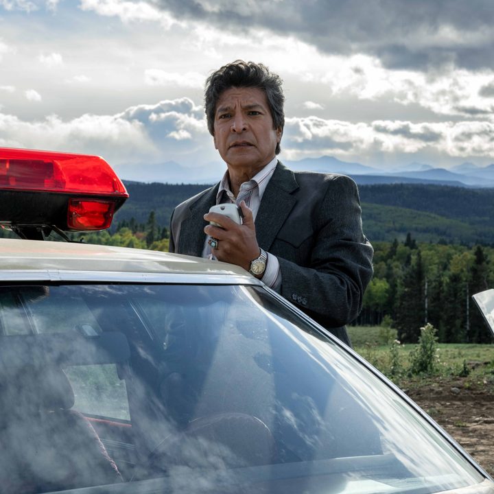 Gil Birmingham holds a police radio in Under the Banner of Heaven.