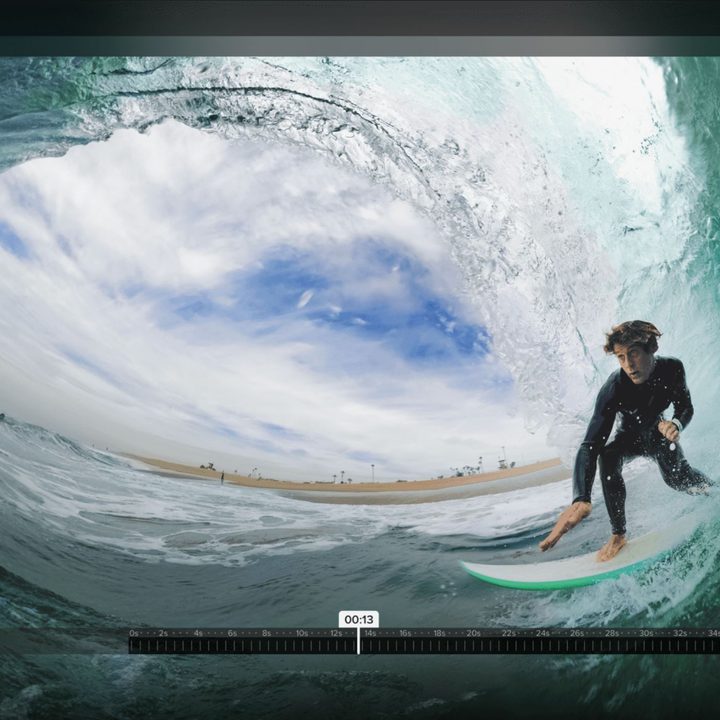 GoPro Player interface with super wide angle footage of a surfer riding a wave.