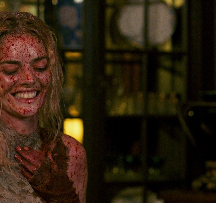 Grace laughs in a blood-soaked dress in Ready or Not.