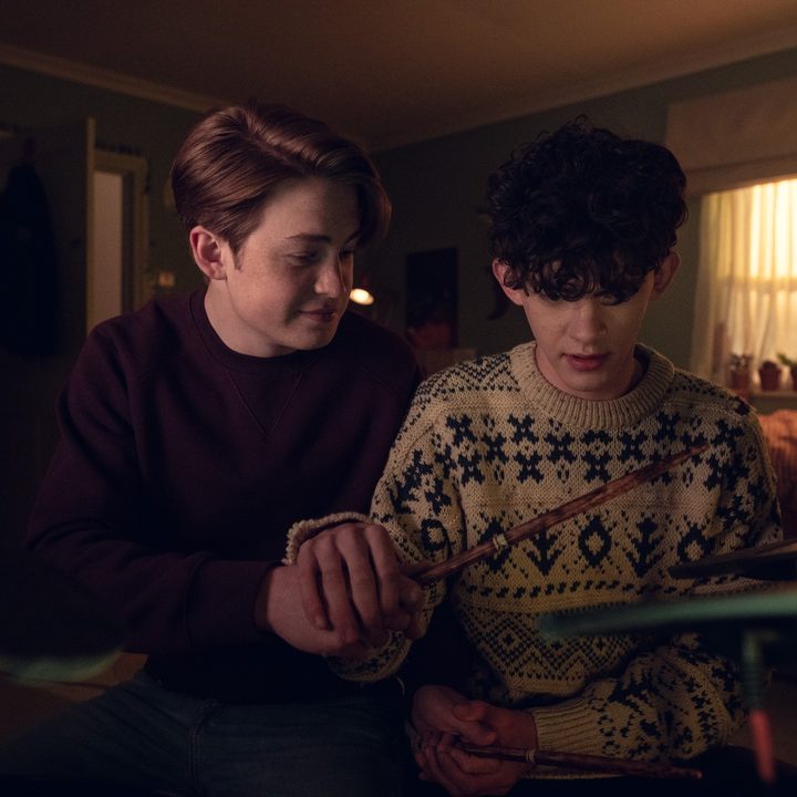 Charlie shows Nick how to play the drums in Heartstopper.