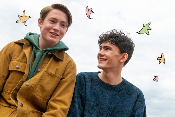 Nick and Charlie smile in a scene from Heartstopper.