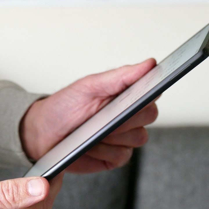 Side view of the Huawei MatePad Paper held in hand.