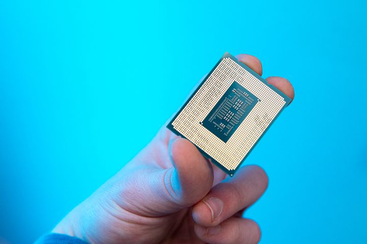 Someone holding the Core i9-12900KS processor.