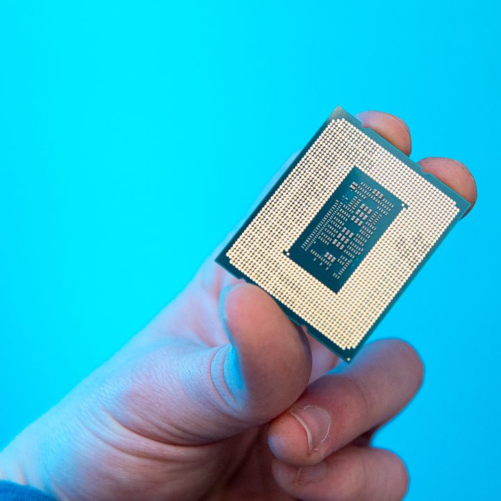 Someone holding the Core i9-12900KS processor.