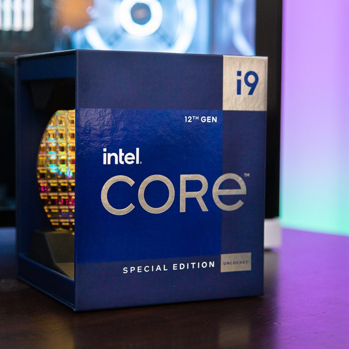 The Intel Core i9-12900KS box sits in front of a gaming PC.