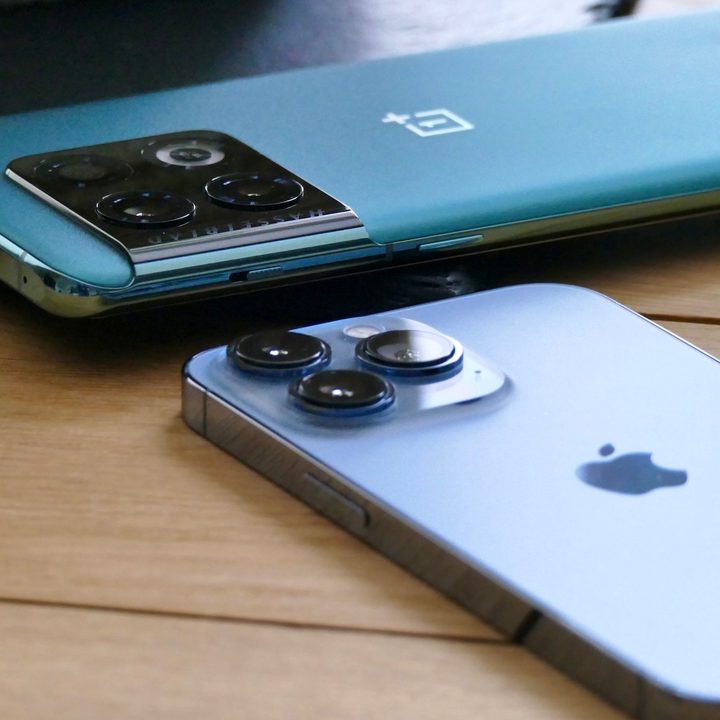 OnePlus 10 Pro and Apple iPhone 13 Pro seen from the back.