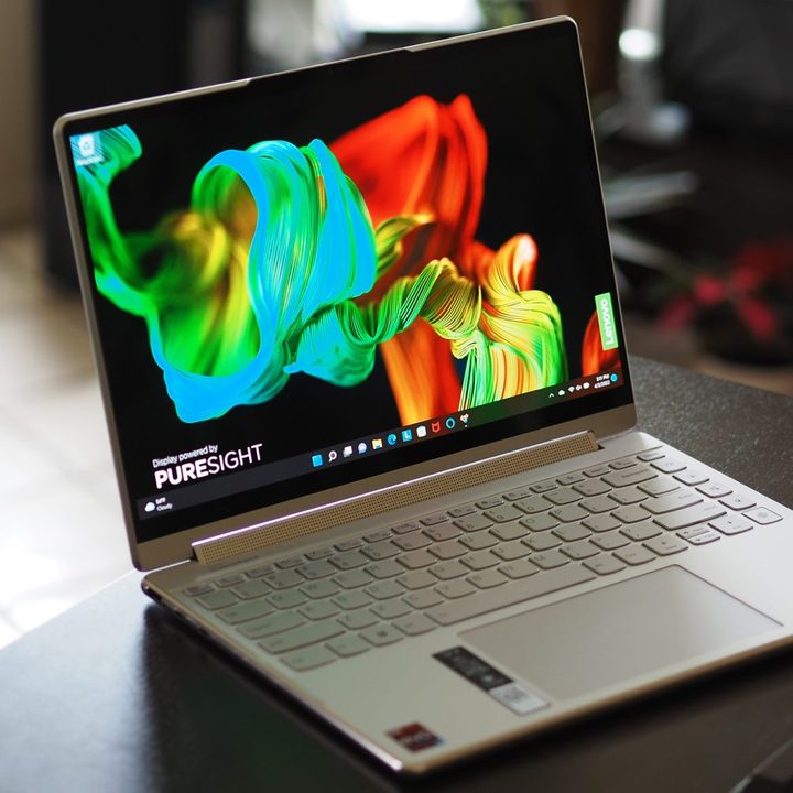 Lenovo Yoga 9i 14 Gen 7 laptop sits on a small desk.