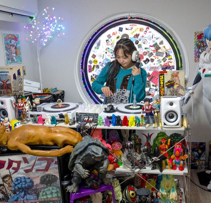 A DJ practices in her room in the Nakagin Capsule Tower.