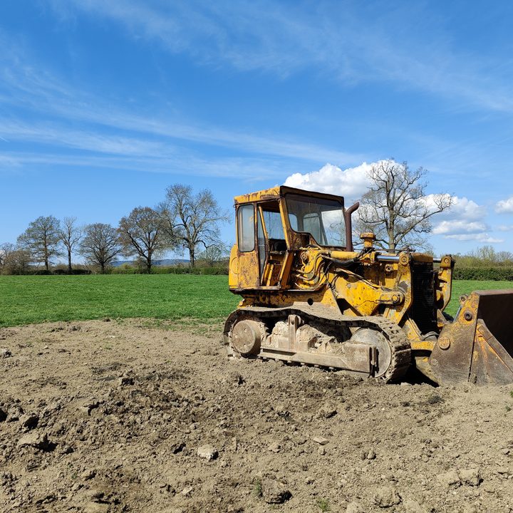 A digger in a field shot with the OnePlus 8 Pro main camera photo.