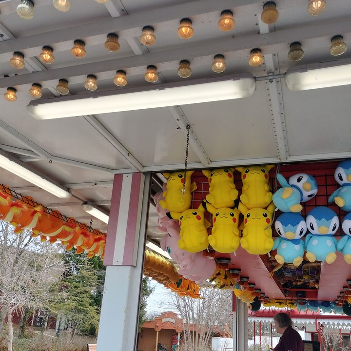 Stuffed toys displayed at a carnival game.