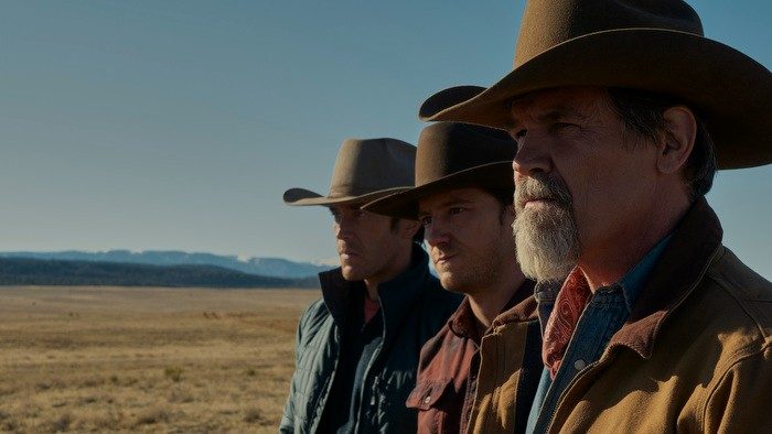 The cast of Outer Range looks out over the prairie.