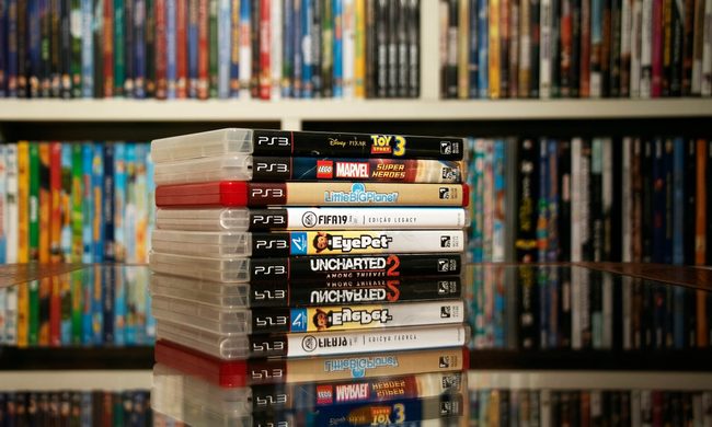 A stack of PS3 games.