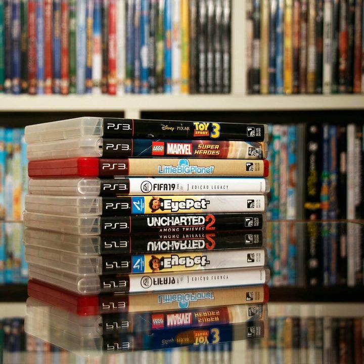 A stack of PS3 games.