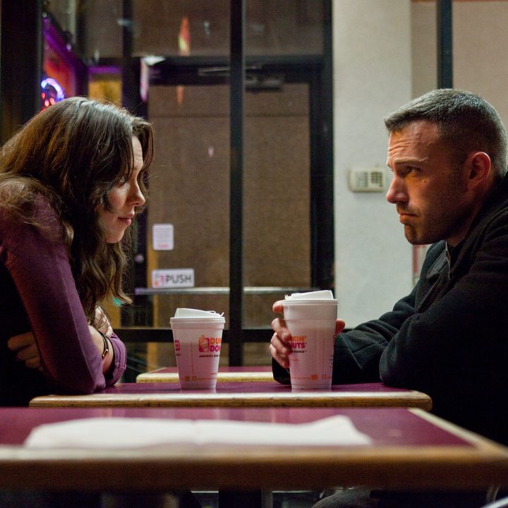 Rebecca Hall sits across a table from Ben Affleck in The Town.