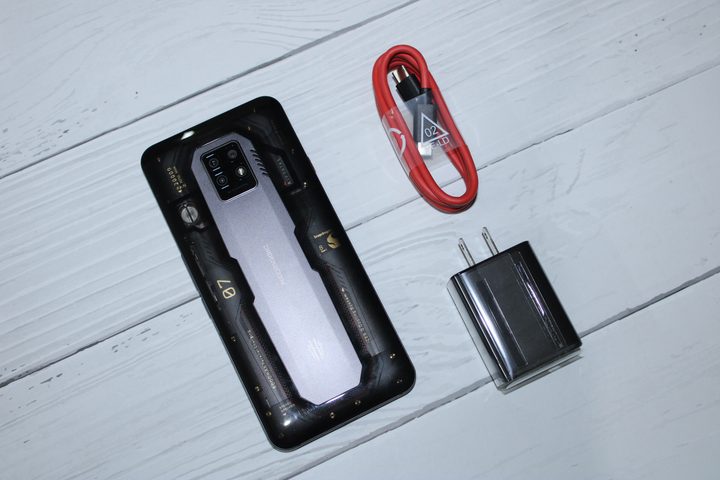 RedMagic 7 Pro with charger and wire kept on table.