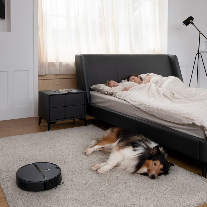 Roborock E4 smart vacuum cleaning quietly during a family nap.