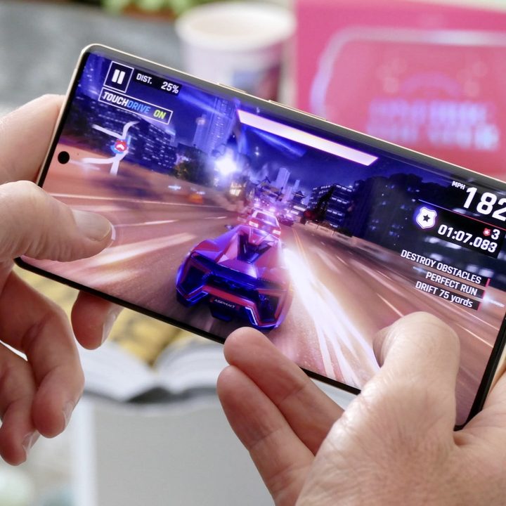 Man playing a game on the Google Pixel 6 Pro.