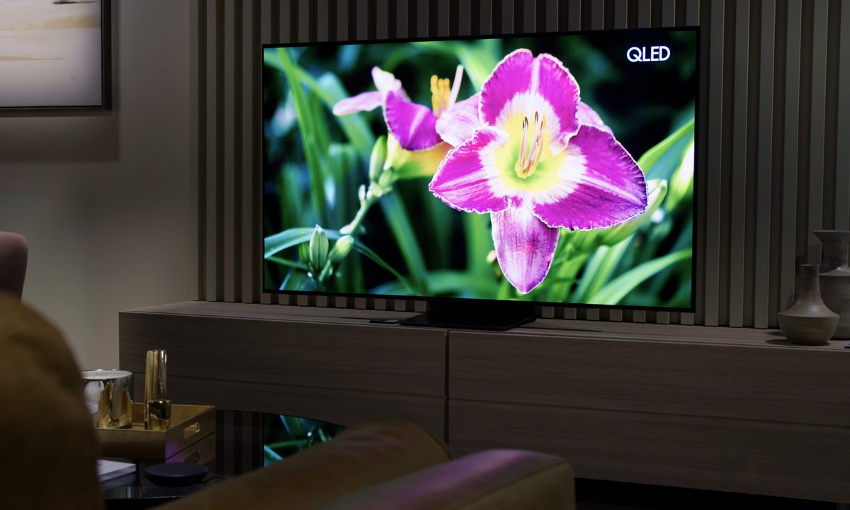 Samsung S95B OLED TV with image of a bright flower on screen.