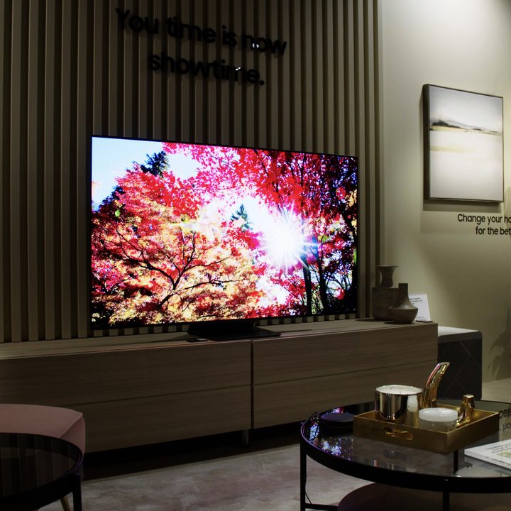 Samsung S95B OLED TV with bright image on-screen.