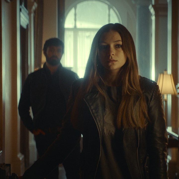 Ellie stands in front of her father Brian in a scene from The Cellar