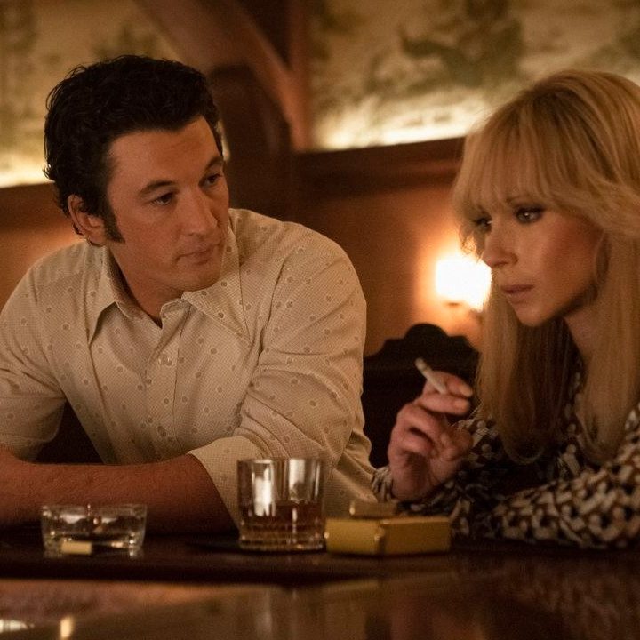 Miles Teller as Al and Juno Temple as Bettye share a drink at a bar in The Offer.