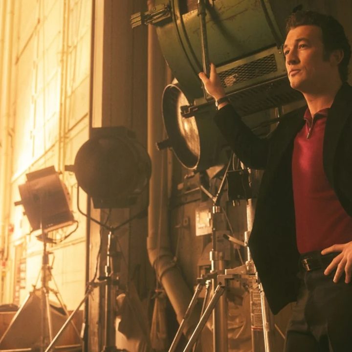 Miles Teller as Al Ruddy stands on a studio backlot in The Offer.