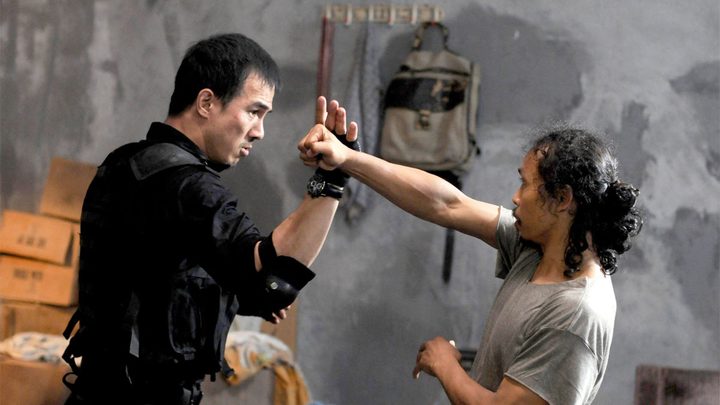 Two characters engaged in hand-to-hand combat in The Raid: Redemption.