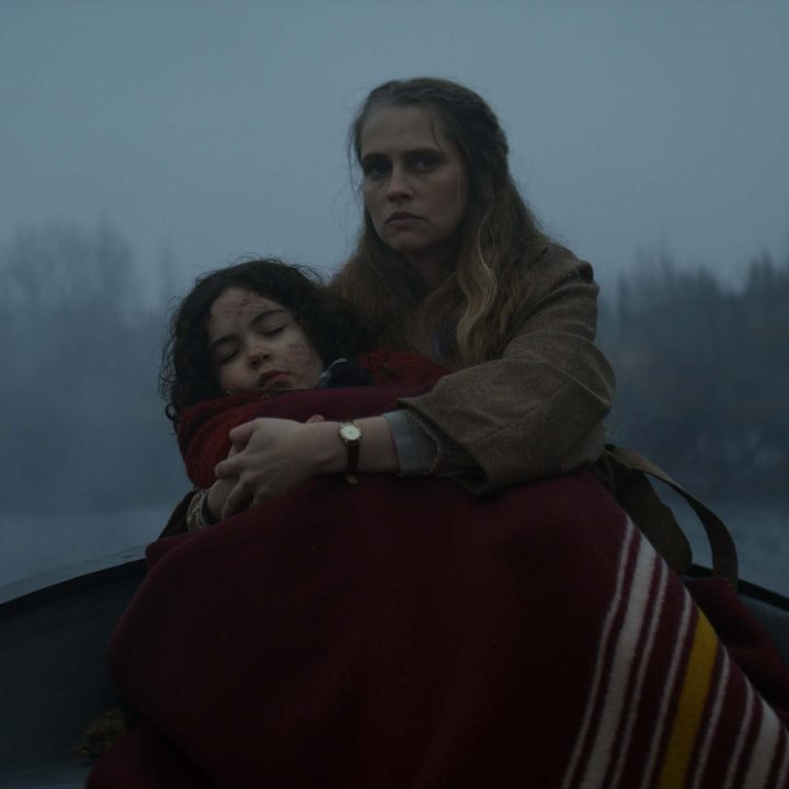 Rachel holds Elliot at the end of a boat in The Twin.