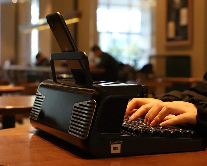 The typewriter keyboard with the JBL sticker on the side.