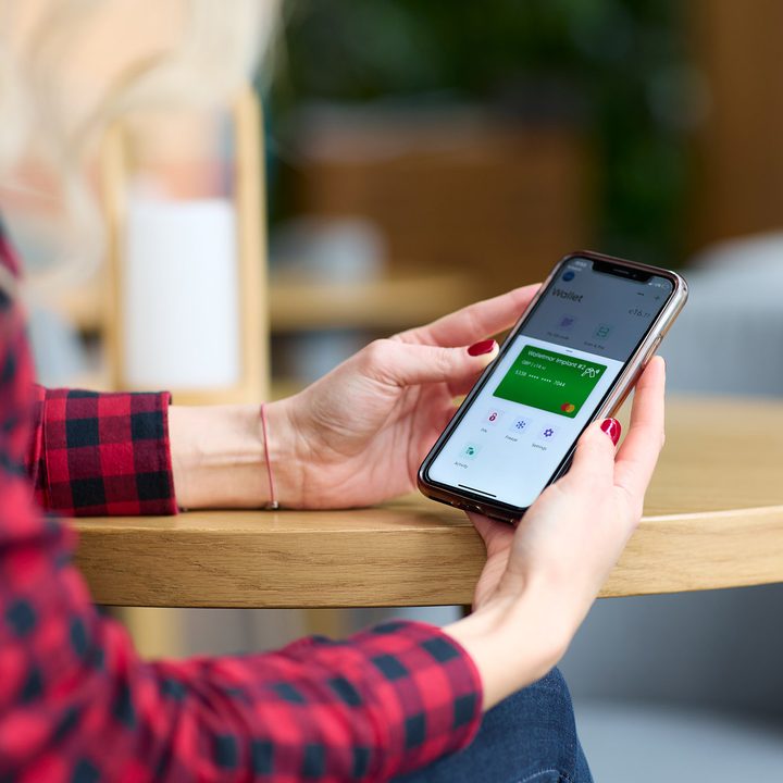 Woman using the Walletmor app.